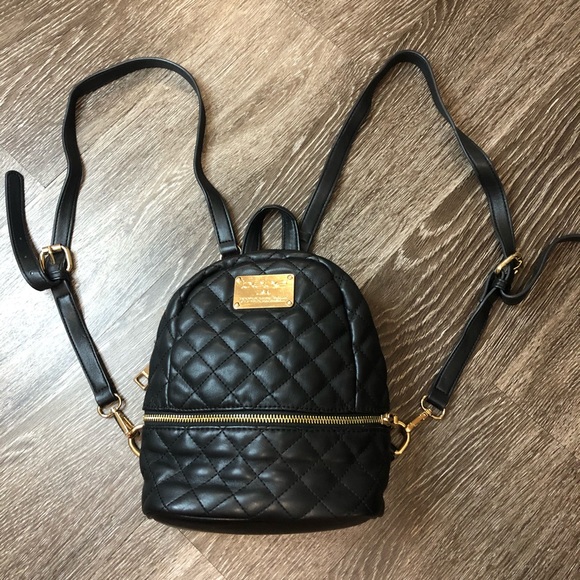 bebe Handbags - Bebe leather quilted mini backpack